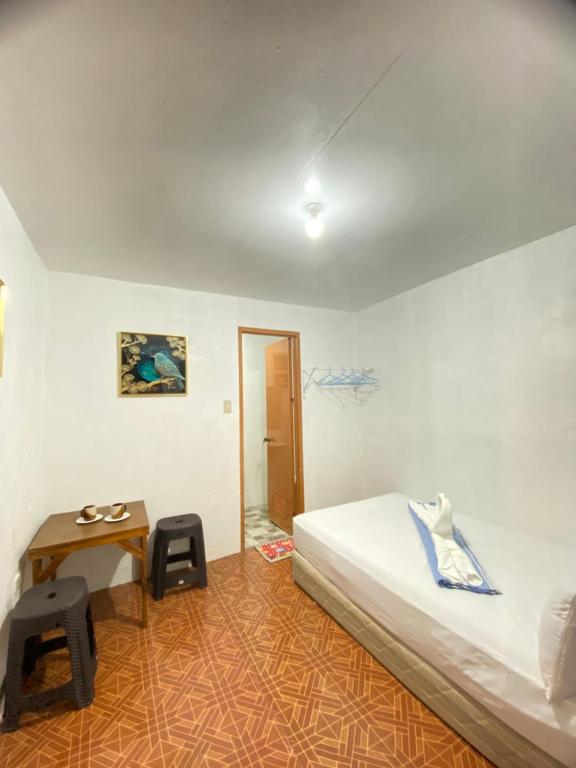 Postel nebo postele na pokoji v ubytování Jasmine Inn at Bucana Beach El Nido
