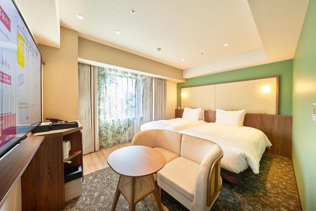 Postel nebo postele na pokoji v ubytování Keisei Richmond Hotel Tokyo Kinshicho