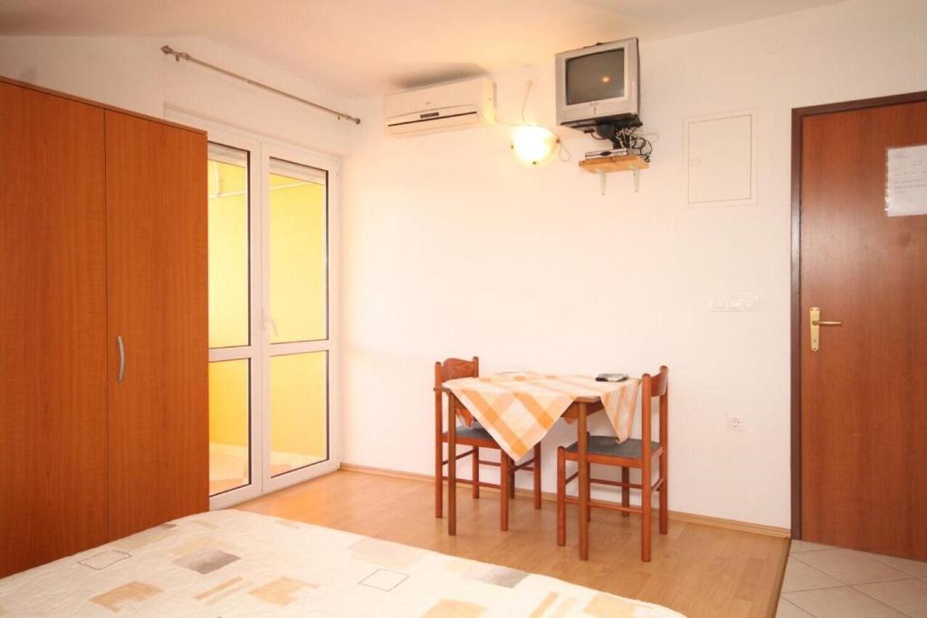 Posteľ alebo postele v izbe v ubytovaní Apartments Sea view