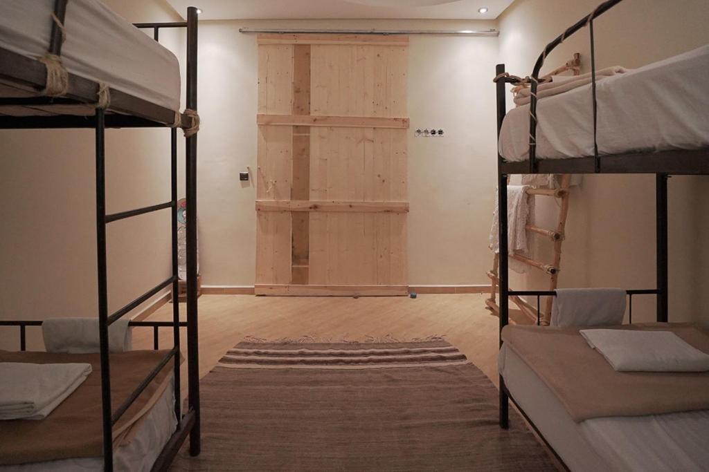 Postel nebo postele na pokoji v ubytování Desart Hostel
