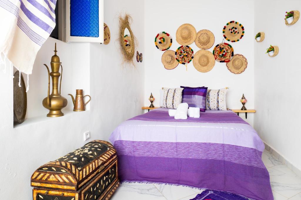 Uma cama ou camas num quarto em RIAD AMR