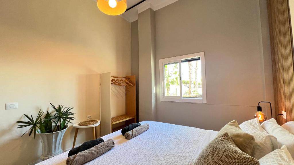 a bedroom with a bed and a window at Coastal Nest in Alcalá in Alcalá