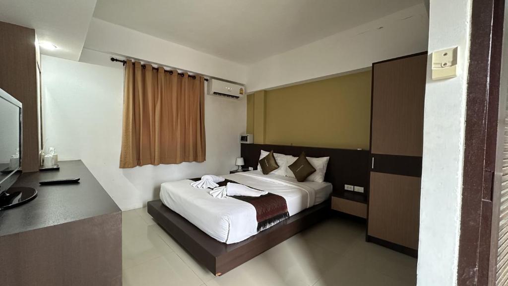 Postel nebo postele na pokoji v ubytování MM Hill Koh Samui Hotel - SHA Certified