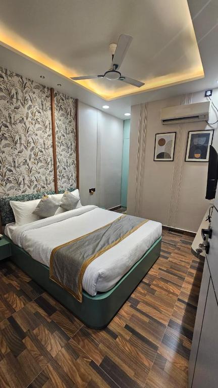 Cama o camas de una habitación en Dashrath Inn near Ramjanmbhoomi