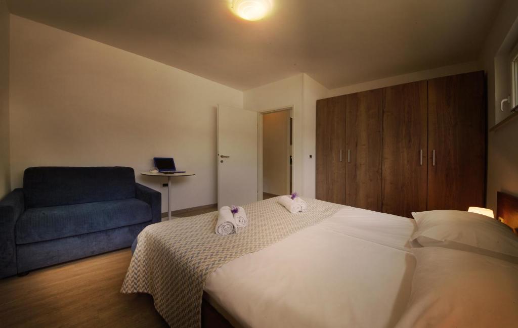 Postel nebo postele na pokoji v ubytování Adria Apartments - Hotel & Resort Adria Ankaran