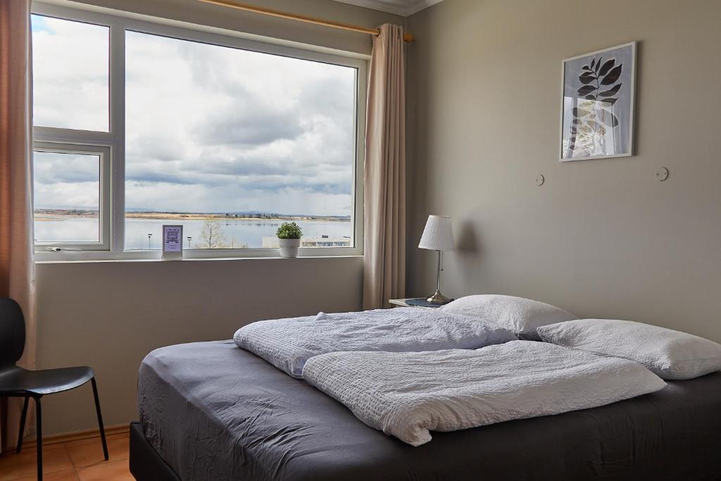 Postel nebo postele na pokoji v ubytování Hótel Laugarvatn