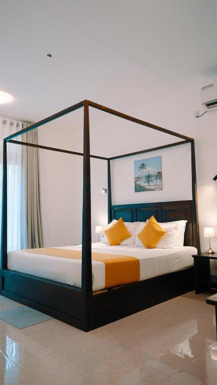 Postel nebo postele na pokoji v ubytování Lion Gate Hotel Sigiriya