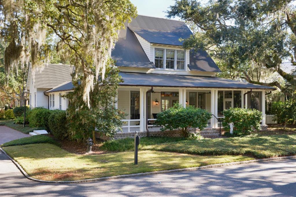 a house on a street with a tree at 3 Bedroom Wilson Village Home 14 in Bluffton
