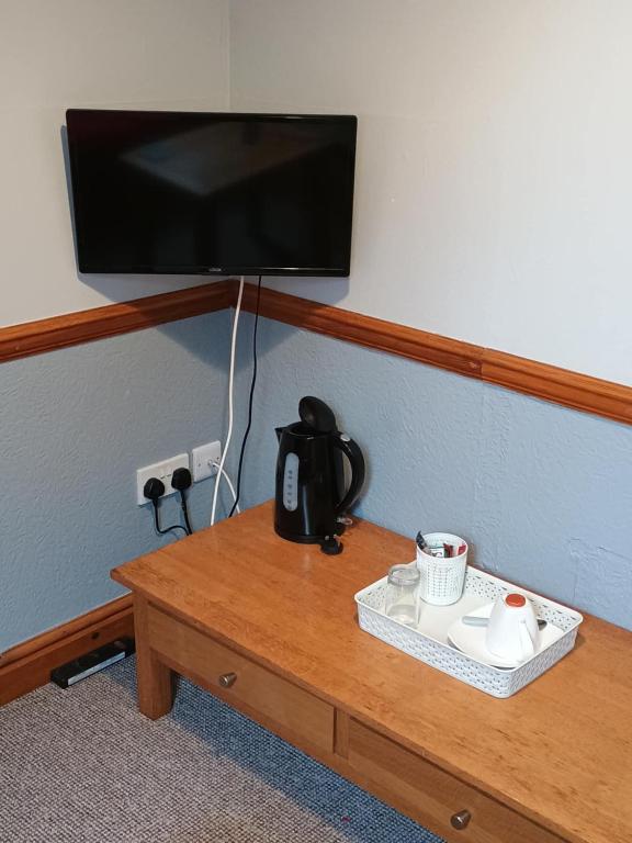 TV a/nebo společenská místnost v ubytování sark guest house