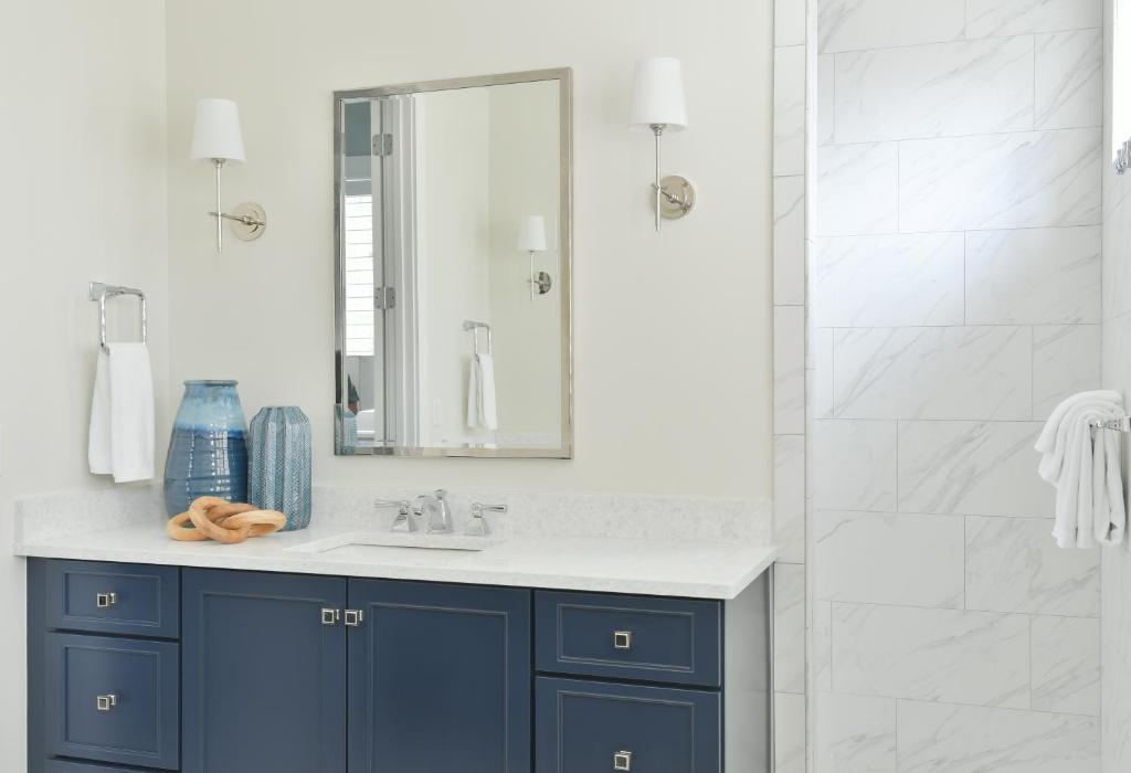 a bathroom with a blue sink and a shower at Lagoon View 3 Bedroom Moreland Village Home 5602 in Bluffton