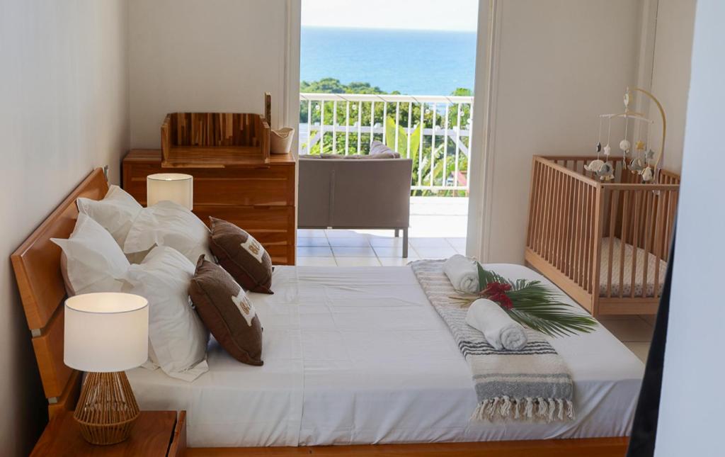 Postel nebo postele na pokoji v ubytování Villa Constellation vue Mer piscine et plage à pied