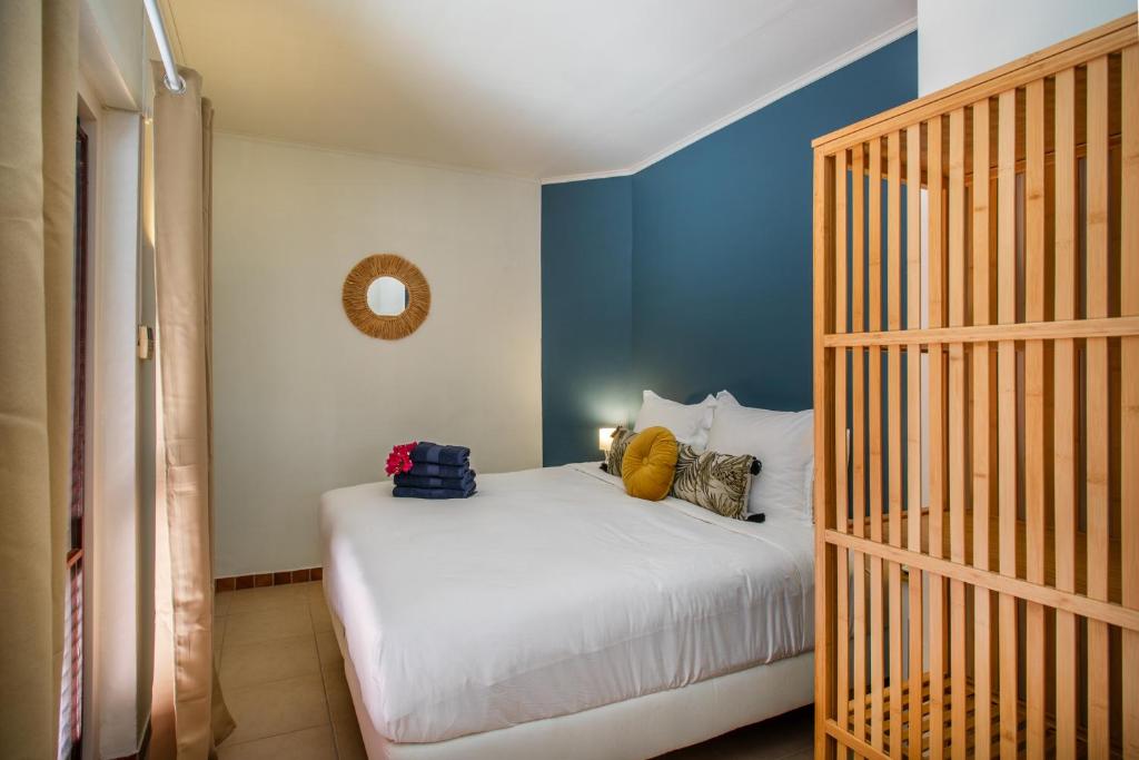 Postel nebo postele na pokoji v ubytování Bloublou Apartments Curaçao