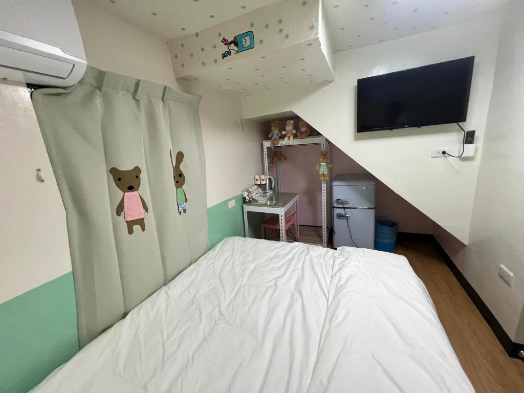 TV a/nebo společenská místnost v ubytování Chaonima B&B 潮尼馬民宿
