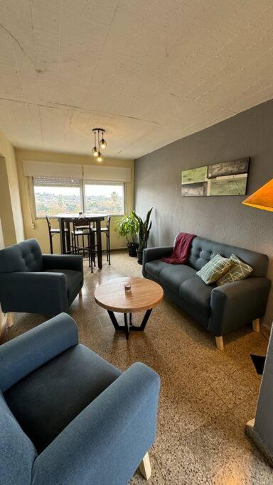 a living room with couches and a table at Buena Vista in Paysandú