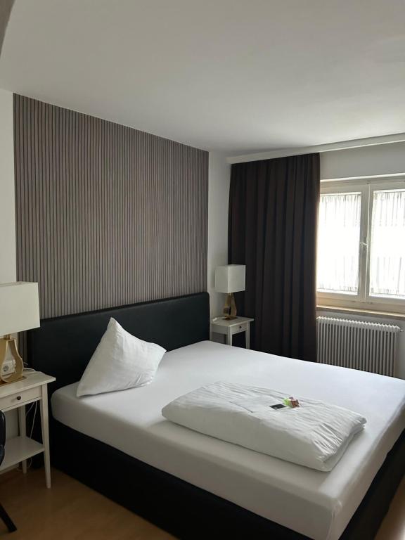 Postel nebo postele na pokoji v ubytování Hotel Berg
