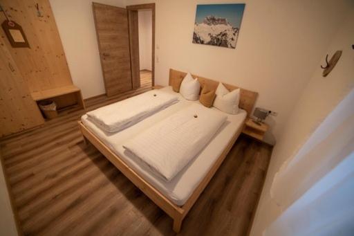 Postel nebo postele na pokoji v ubytování Haus Bazigg
