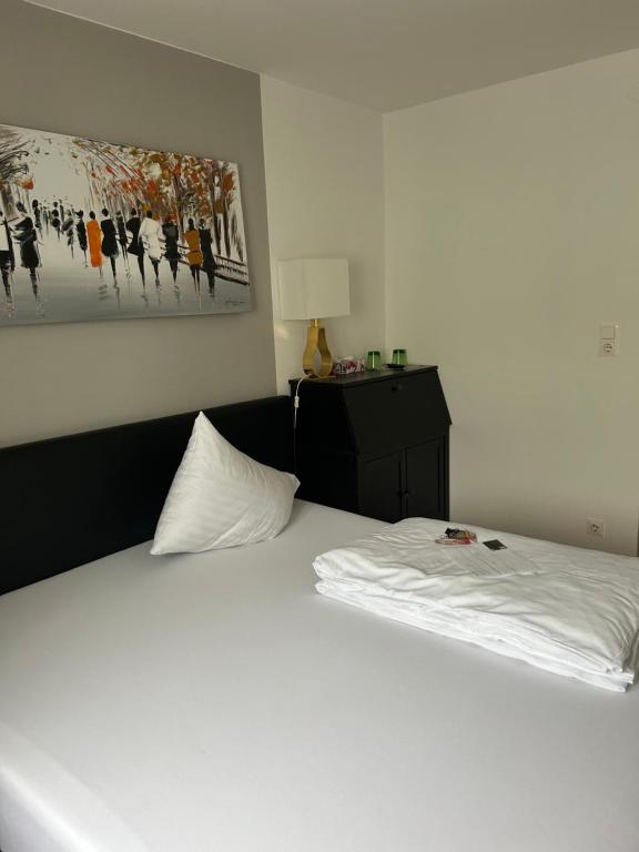 Postel nebo postele na pokoji v ubytování Hotel Berg