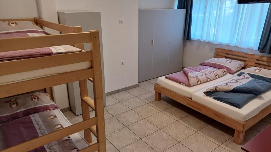 Postel nebo postele na pokoji v ubytování Ferienwohnungen Hebalm