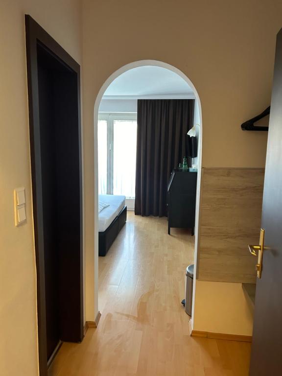 Postel nebo postele na pokoji v ubytování Hotel Berg