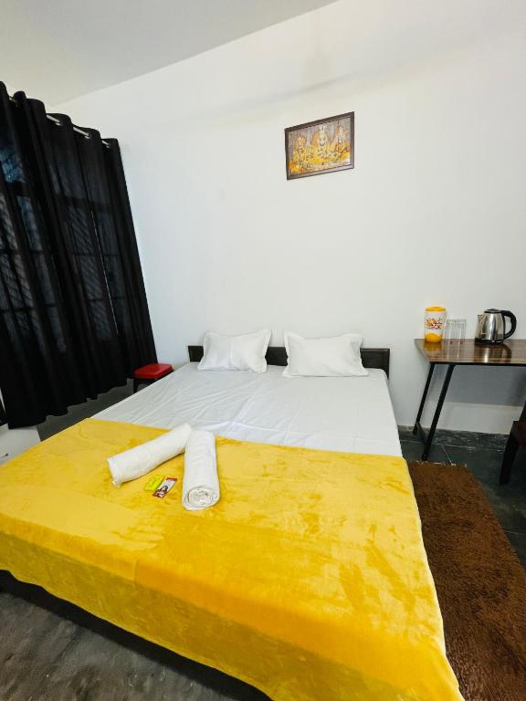 Postel nebo postele na pokoji v ubytování Shree Balaji Homestay