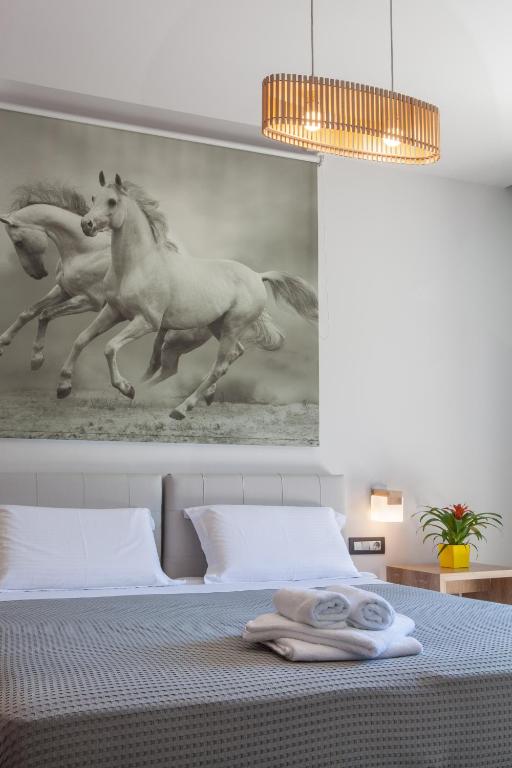 Postel nebo postele na pokoji v ubytování Anemos Rooms & Apartments