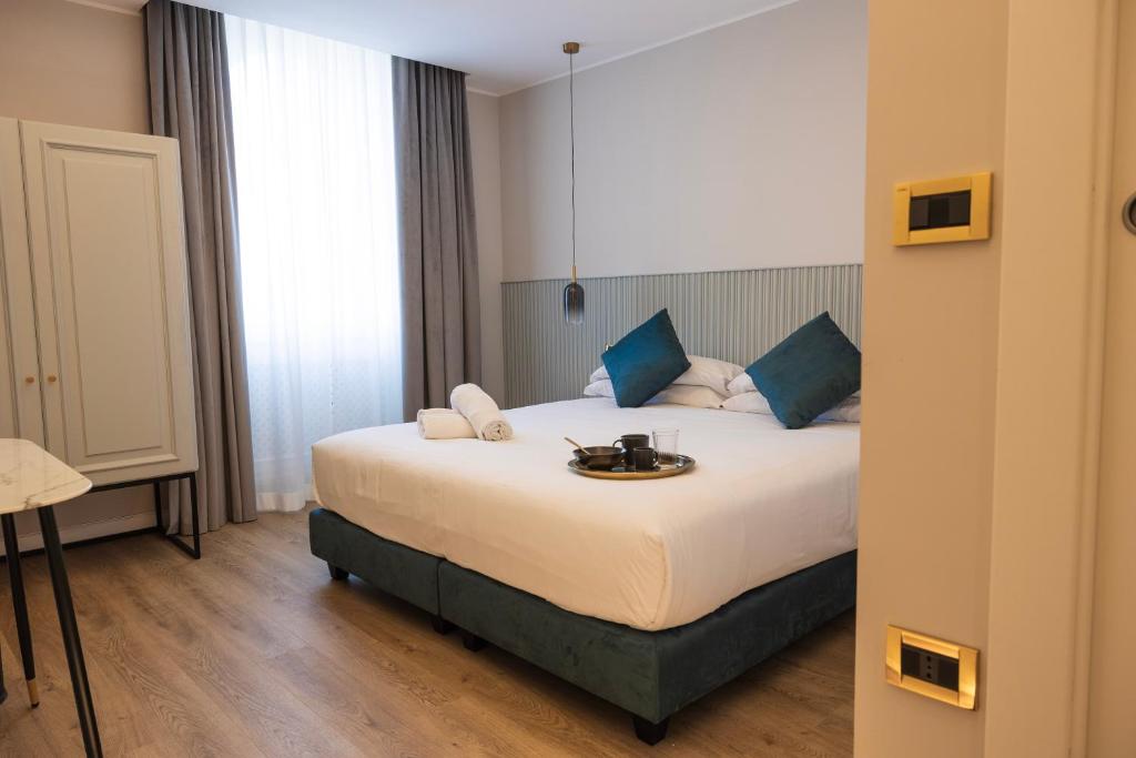 Postel nebo postele na pokoji v ubytování Tiburtina 86 Luxury Suites