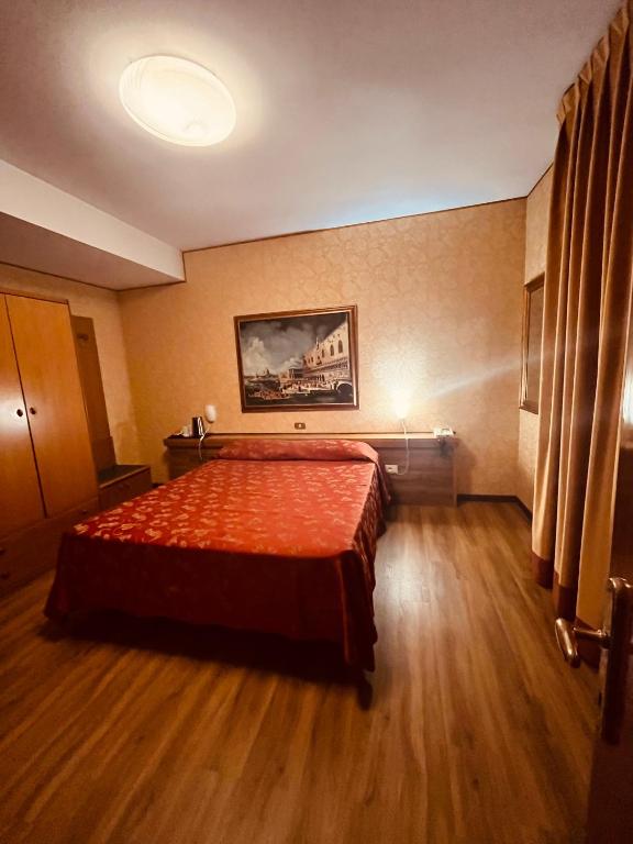 Postel nebo postele na pokoji v ubytování Hotel Al Sole