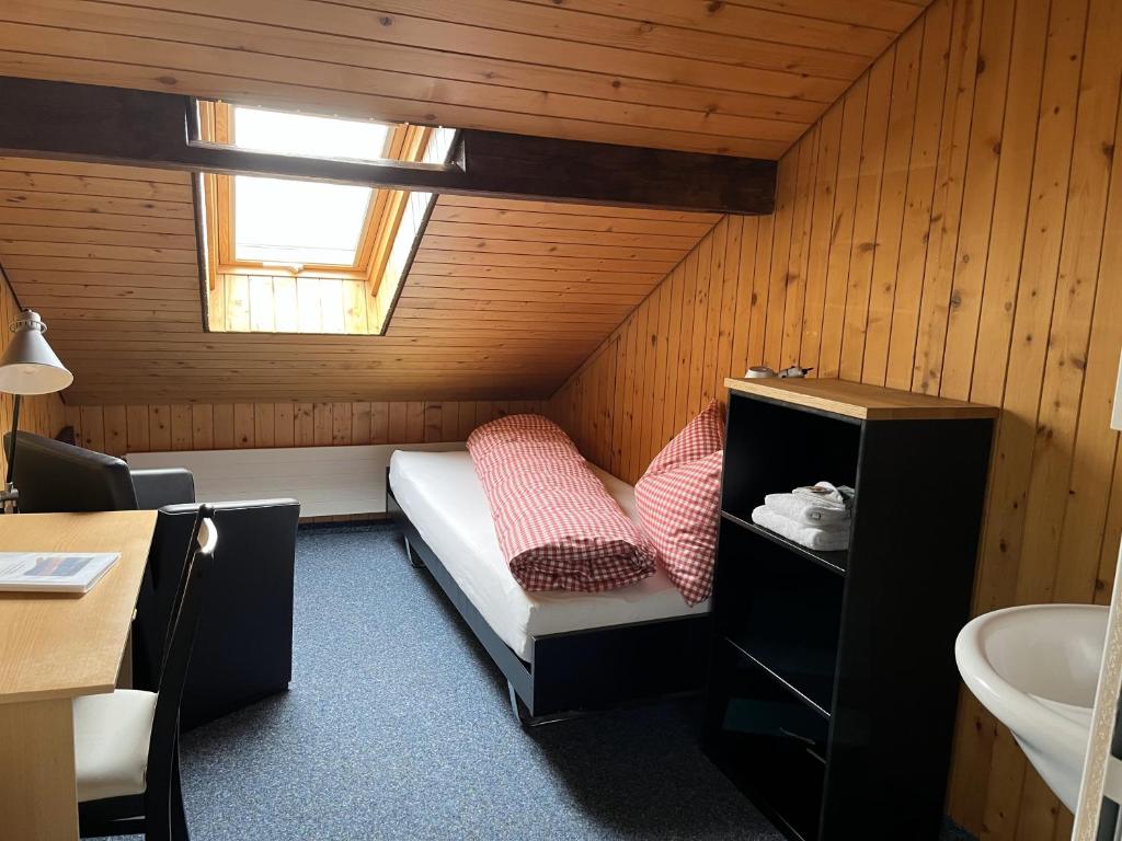 Postel nebo postele na pokoji v ubytování Guesthouse Sonnegg
