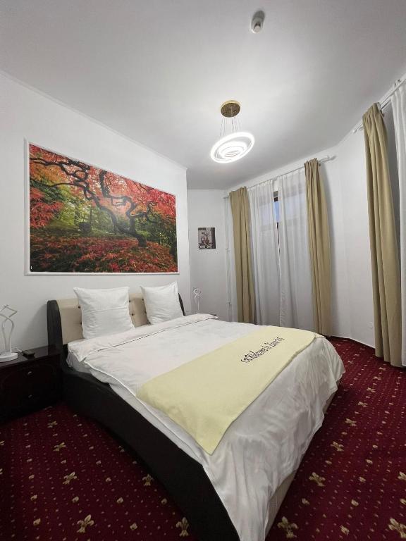 Postel nebo postele na pokoji v ubytování Hotel EvoZava Central