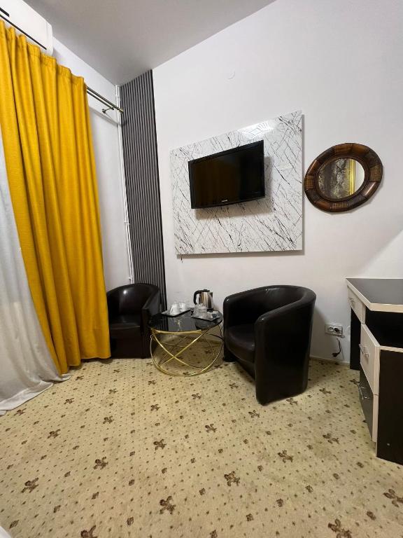 TV a/nebo společenská místnost v ubytování Hotel EvoZava Central