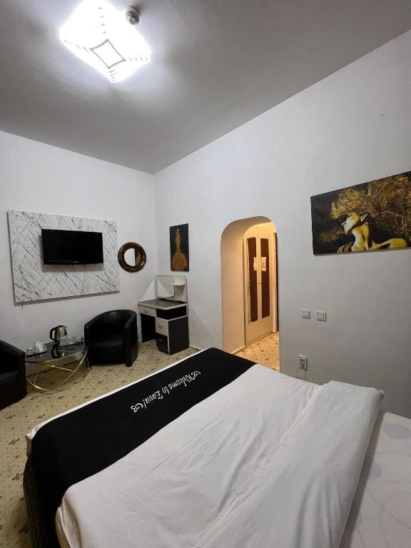 Postel nebo postele na pokoji v ubytování Hotel EvoZava Central