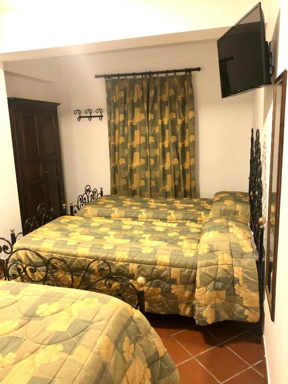 Posteľ alebo postele v izbe v ubytovaní Hotel Bucaneve
