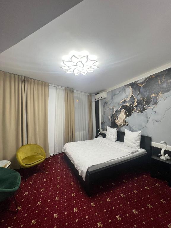 Postel nebo postele na pokoji v ubytování Hotel EvoZava Central