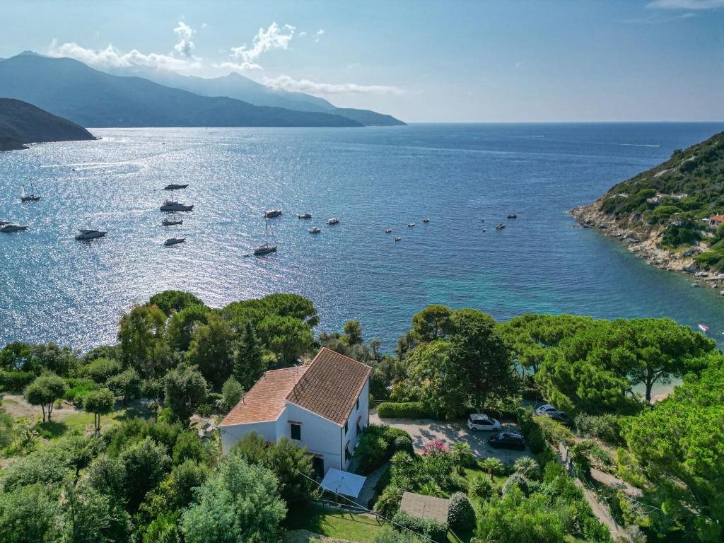 an aerial view of a lake with boats in the water at La Terrazza sul Forno - Goelba in Portoferraio