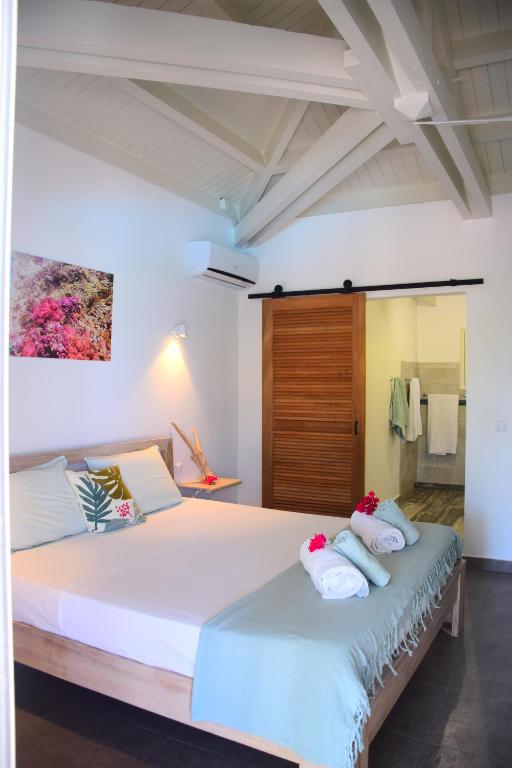 Postel nebo postele na pokoji v ubytování TIKO LODGE SXM