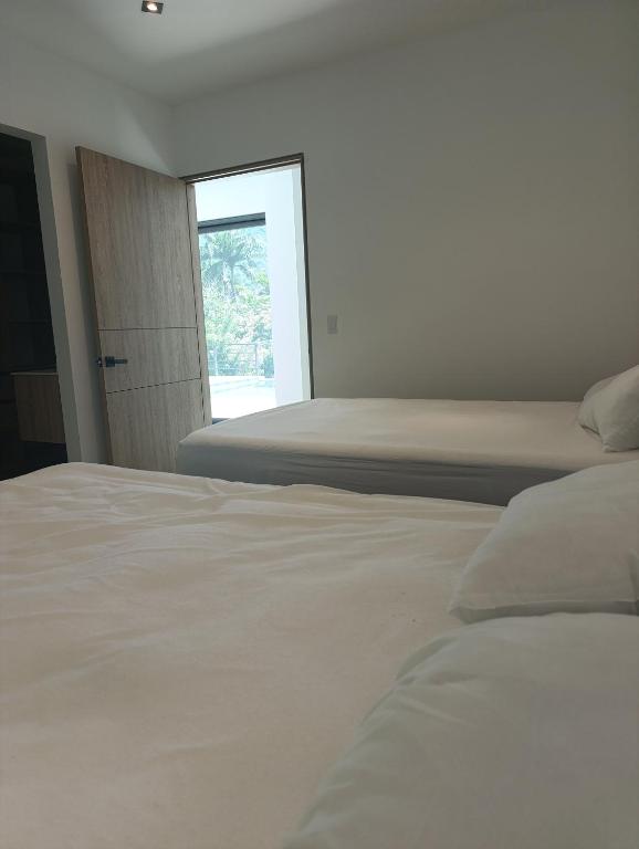Postel nebo postele na pokoji v ubytování Casa Mezcal