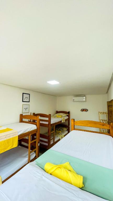 Postel nebo postele na pokoji v ubytování Tô em Casa