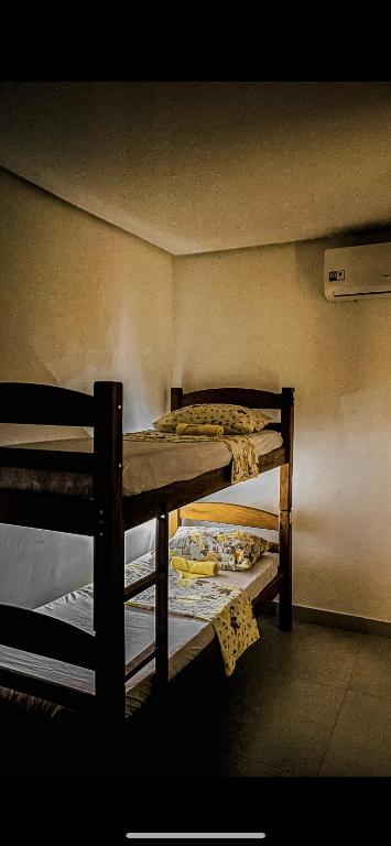 Postel nebo postele na pokoji v ubytování Tô em Casa