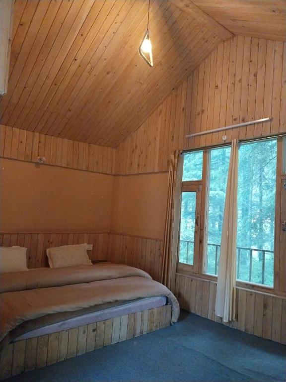 Postel nebo postele na pokoji v ubytování Mud House by Hostalgic