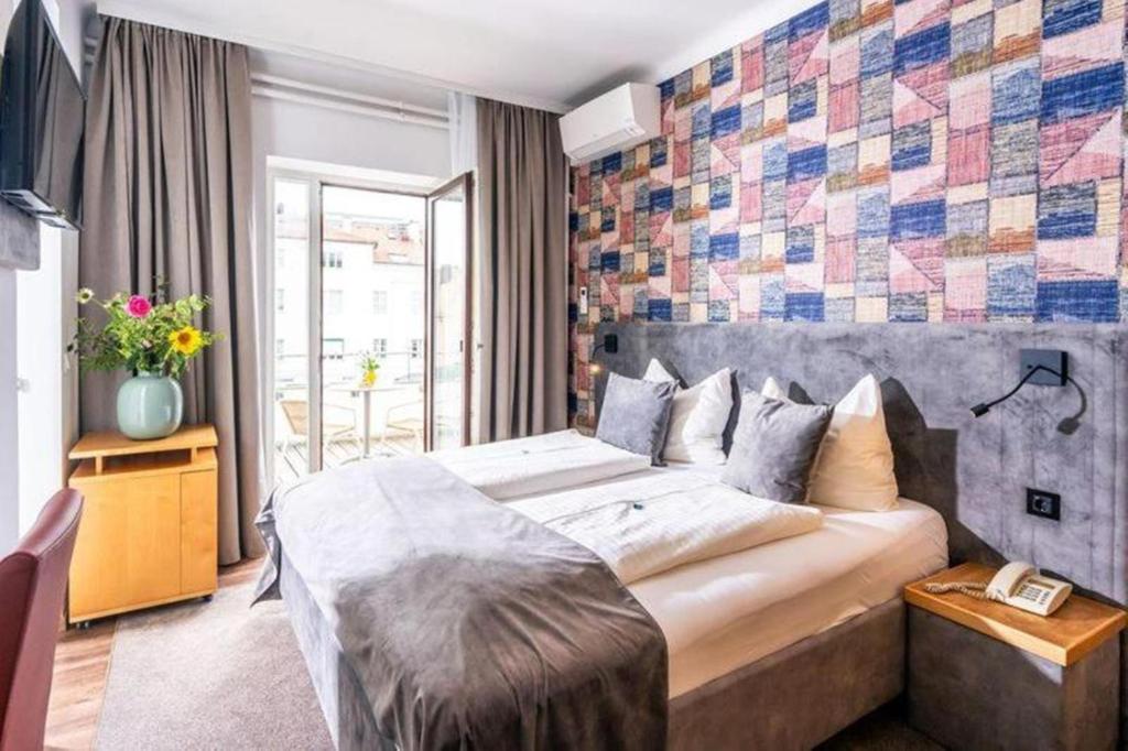 Cama o camas de una habitación en Gästehaus Klinglhuber