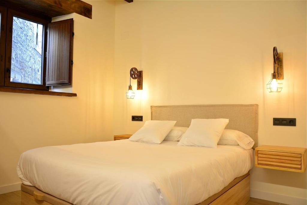 Cama o camas de una habitación en La casa de la abuela Gabina, Duruelo de la Sierra - 12 personas