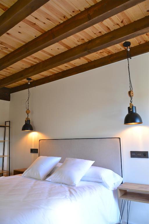 Cama o camas de una habitación en La casa de la abuela Gabina, Duruelo de la Sierra - 12 personas