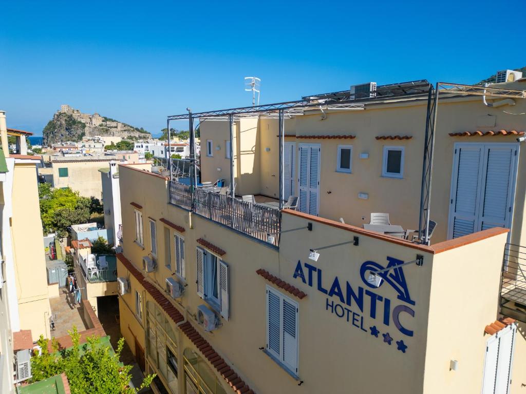 a view of an apartment building with a sign on it at Albergo Atlantic in Ischia Town
