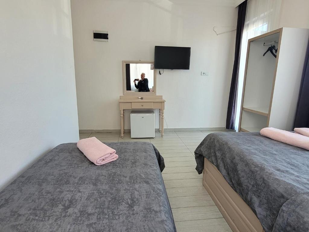 Postel nebo postele na pokoji v ubytování Cetin Pansiyon