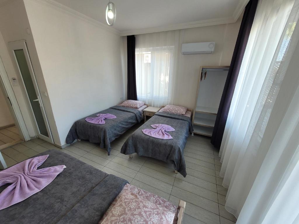 Postel nebo postele na pokoji v ubytování Cetin Pansiyon