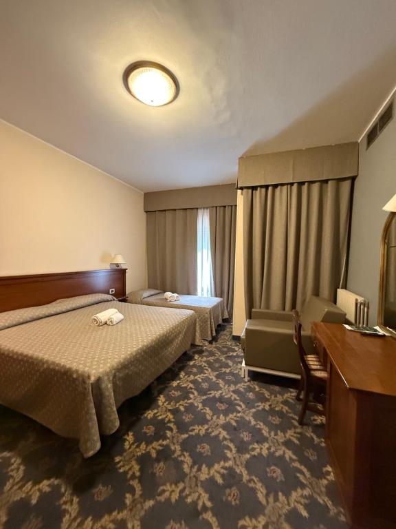 Postel nebo postele na pokoji v ubytování Hotel Terme Posta Padova HOTEL RC12