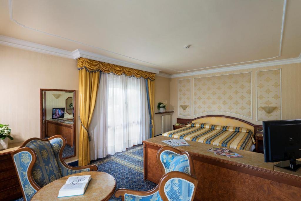 Postel nebo postele na pokoji v ubytování Hotel Apollo Terme