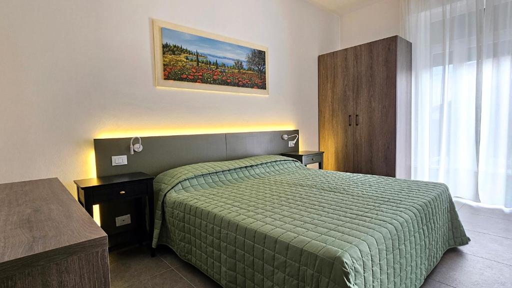 Postel nebo postele na pokoji v ubytování Hotel Marina