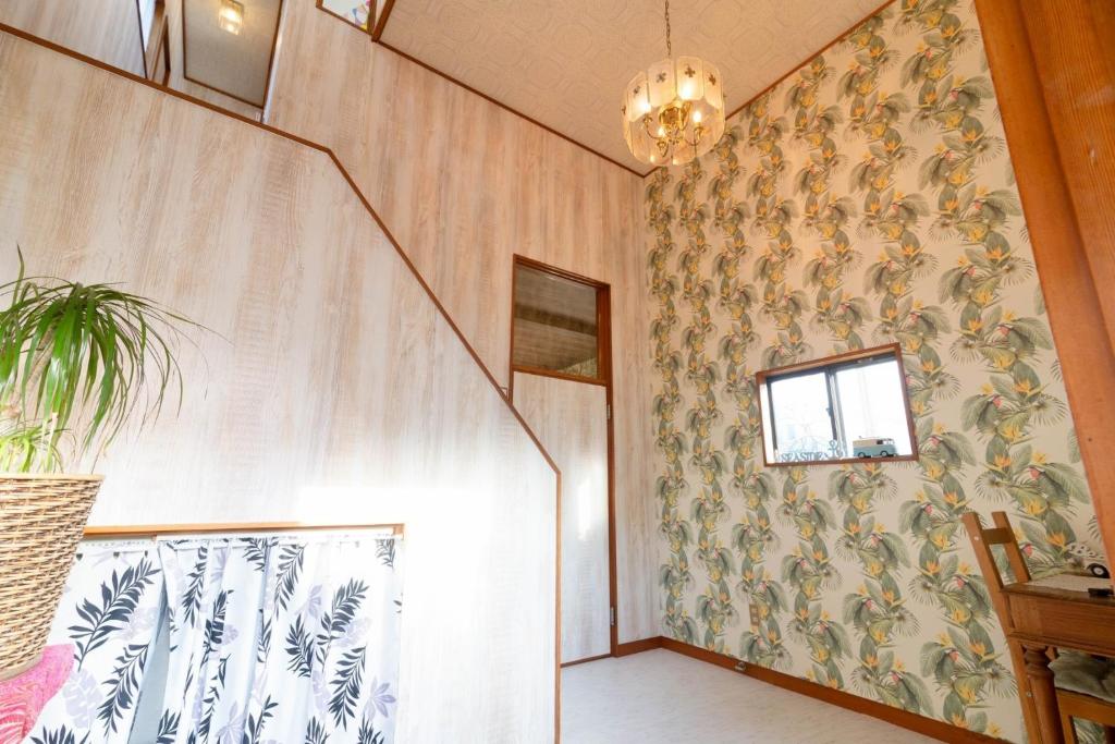 a hallway with a wall with a patterned wall at Long - Vacation STAY 56447v in Manazuru