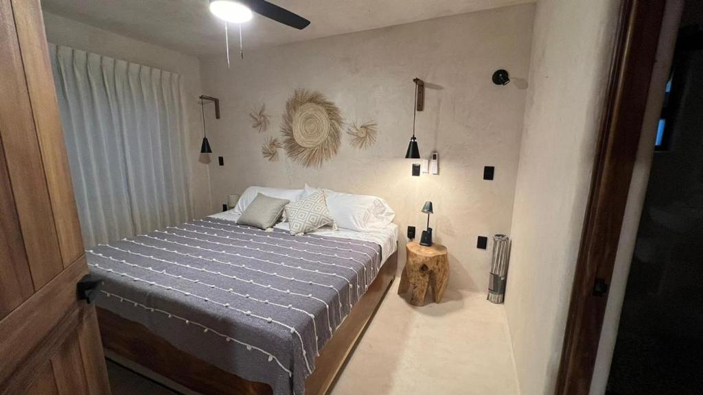 Ένα ή περισσότερα κρεβάτια σε δωμάτιο στο Hábitat Nandá